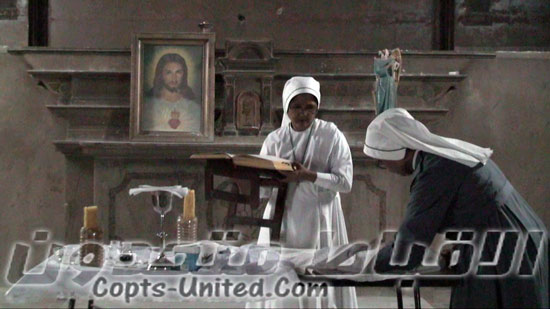 Franciscans pray on the ruins of their church in Suez